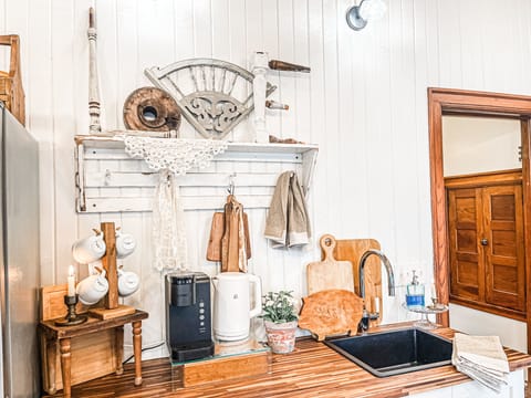 Perfectly curated kitchen with new appliances, and antique decor adds the charm.