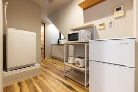 Design Apartment | Private kitchen | Full-size fridge, microwave, stovetop, rice cooker