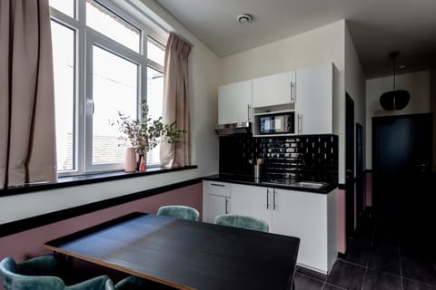Comfort Apartment | Private kitchen | Microwave, stovetop, electric kettle, cookware/dishes/utensils