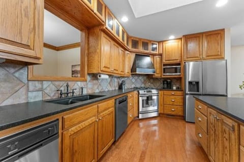 Open concept kitchen with pass through to 2nd dining area