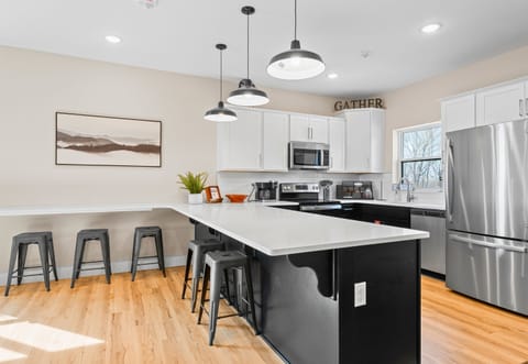 The dining and kitchen areas flow together, creating a seamless space for entertaining and enjoying meals together.