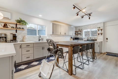 Gather around our dining table, perfect for enjoying meals and conversations. The inviting setting ensures every meal is a delightful experience, creating moments to savor.