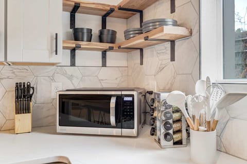 Discover convenience in our fully-equipped kitchen, complete with a stove, oven, microwave, dishwasher, and all the utensils you need. Cook, dine, and enjoy every culinary moment with ease.