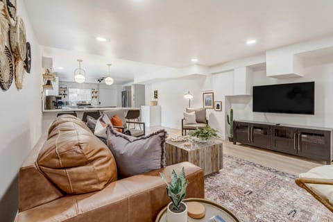 Experience spacious comfort in our living room, complete with a cozy sofa and a hanging chair for a touch of relaxation. Stylish, inviting, and designed for your ultimate comfort.