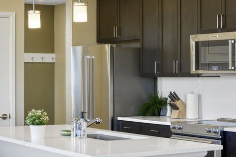 Spacious kitchen island showcasing ample cupboards in the kitchen