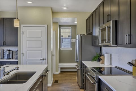 Modern appliances and large sink for the kitchen