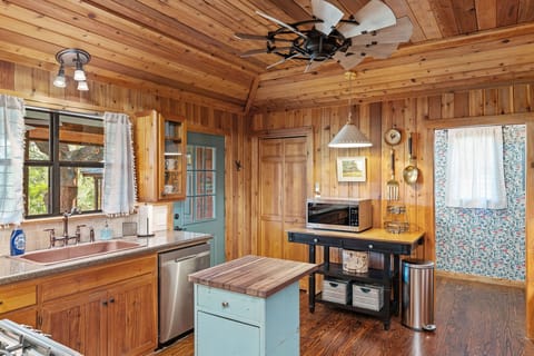 Spacious Kitchen with windmill fan. 