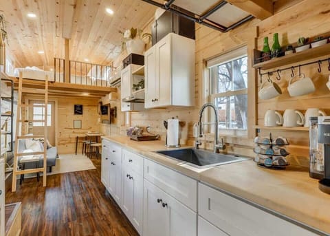 Savor the ease of centralized design: enjoy home amenities while cooking in our convenient kitchen.