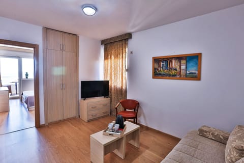 Standard Suite | Living area | 40-inch LCD TV with cable channels