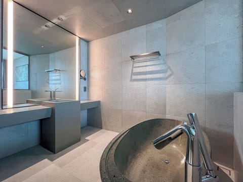 Seafront Contemporary Family Room | Bathroom | Deep soaking tub, rainfall showerhead, designer toiletries, hair dryer