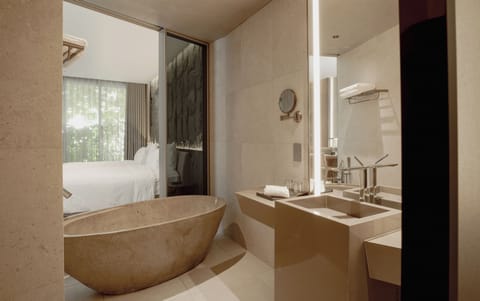 City Pulse Deluxe Twin | Bathroom | Deep soaking tub, rainfall showerhead, designer toiletries, hair dryer