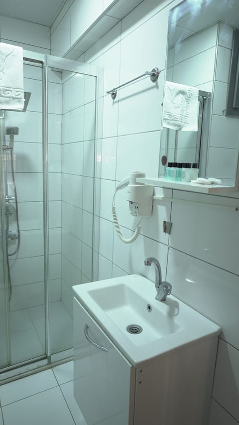 Shower, rainfall showerhead, designer toiletries, hair dryer