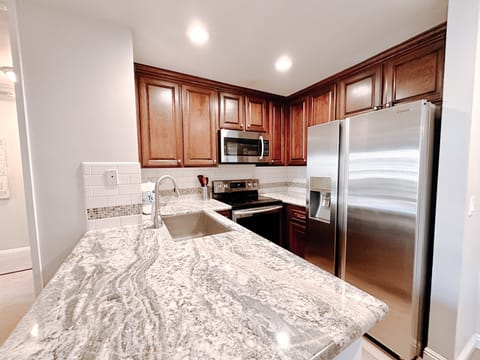 The kitchen includes a full selection of cookware, utensils, and essentials—perfect for preparing and enjoying meals throughout your vacation