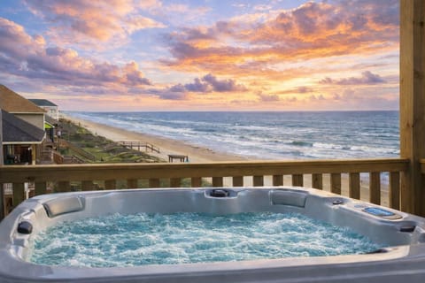 Beachfront hot tub with ocean views at sunset on Bolivar Peninsula, luxury Crystal Beach TX beachfront rental with private spa deck overlooking the Gulf Coast