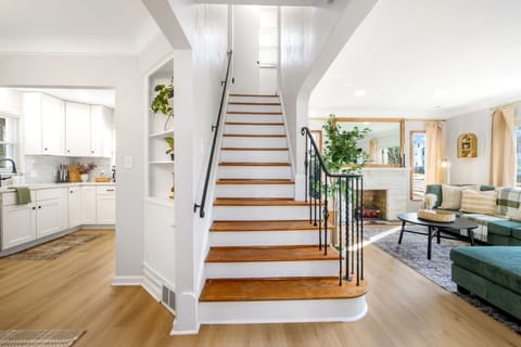 A staircase, gracefully connecting levels, where every step unveils a journey through architectural beauty and home sophistication.
