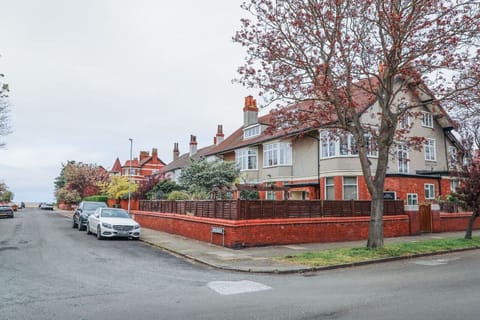 House View: the road view of the Edwardian maisonette with available parking and a tempting glimpse of the sea.