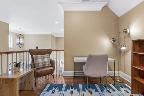 Upper-level workspace with two stylish chairs.