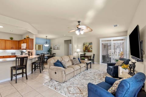 Living Room opens out onto a lovely screen-in porch and opens to Dining nook.