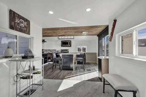 Flows seamlessly into the kitchen and dining area.