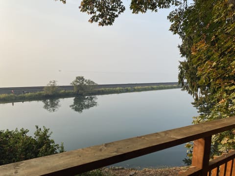 Picnic point lake in the foreground, with a cloudy view the Puget Sound 