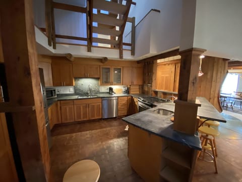 Lovely open kitchen to prep and entertain near living and dining room.