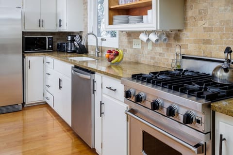 Create memorable meals in the well-appointed kitchen, featuring premium amenities, ample storage, and a convenient layout designed for functionality and style