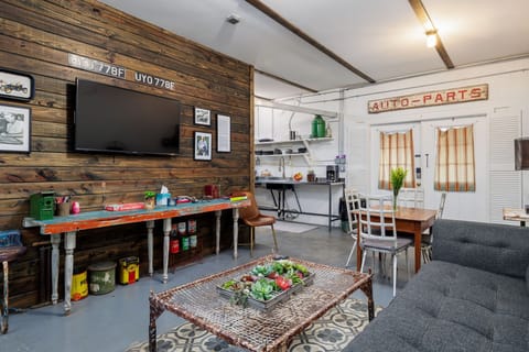 Experience the perfect blend of vintage charm and modern comfort in the stylish living room, designed for relaxation and leisure.