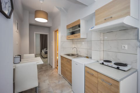 Apartment, Ground Floor | Private kitchen | Mini-fridge, stovetop, coffee/tea maker, electric kettle