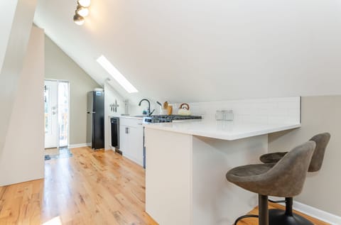 Open kitchen with counter seating for 2