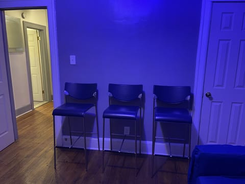 Den/bar has 55 inch smart tv, couch, 3 bar stools and bar for drink set up. 