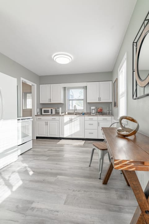 Dining area with seats for two (additional chairs located in laundry room.)