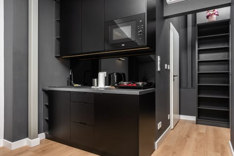 D. Studio Smart Apartments | Private kitchenette | Mini-fridge, microwave, stovetop, coffee/tea maker