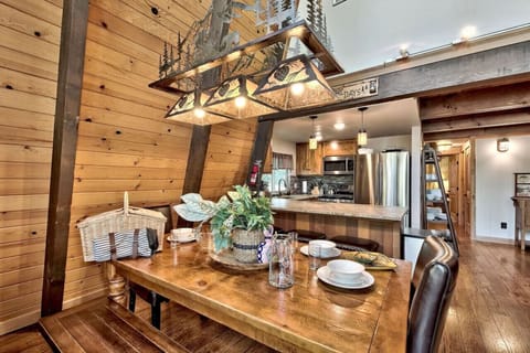 Dining table on main / mid level (seats 8). There’s also bar seating for 3 and another small table that seats 4 adjacent to living area.