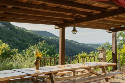 Plant, Sky, Property, Shade, Wood, Natural Landscape, Mountain, Cottage, Wood Stain, Outdoor Furniture