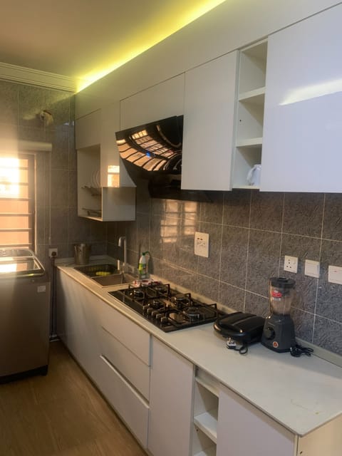Apartment | Private kitchen | Fridge, microwave, stovetop, cookware/dishes/utensils