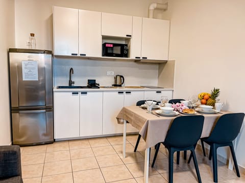 Superior Apartment | Private kitchen | Full-size fridge, microwave, stovetop, electric kettle