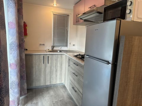 Premium Mobile Home, 3 Bedrooms, Non Smoking, Private Bathroom | Private kitchen | Full-size fridge, stovetop, highchair, cookware/dishes/utensils