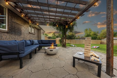 Escape to tranquility on our patio with a couch, fire pit and backyard games.
