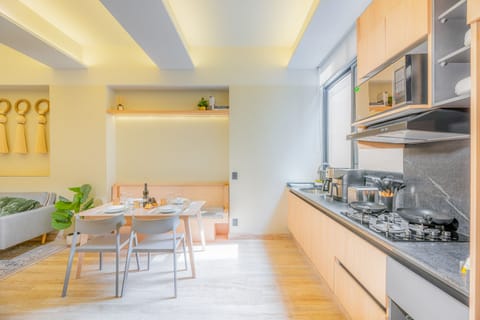 Deluxe Apartment | Private kitchen | Full-size fridge, microwave, espresso maker, coffee/tea maker