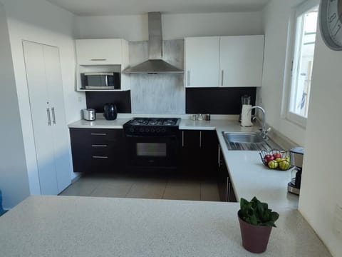 City House | Private kitchen | Microwave, electric kettle, cookware/dishes/utensils