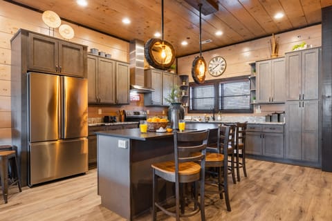 Kitchen features high-end appliances fit for a chef.