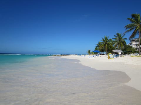 Beach nearby, white sand, beach towels