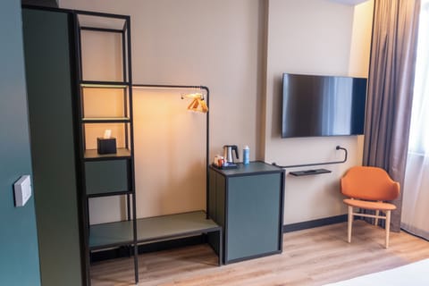 Premium bedding, memory foam beds, minibar, laptop workspace