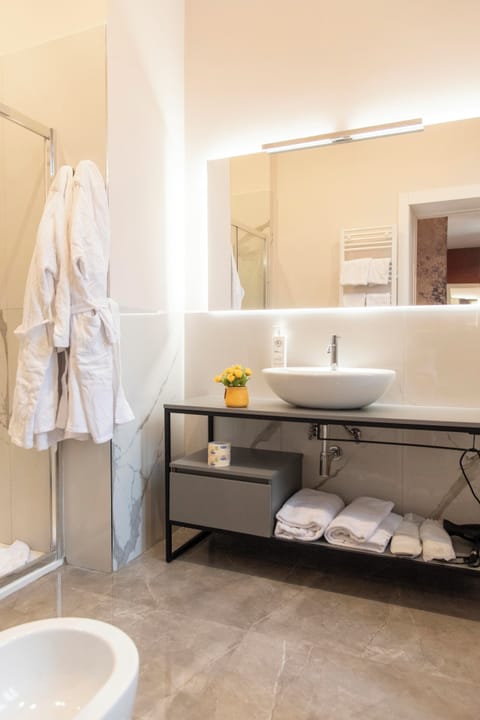 Executive Triple Room | Bathroom | Shower, rainfall showerhead, hair dryer, slippers