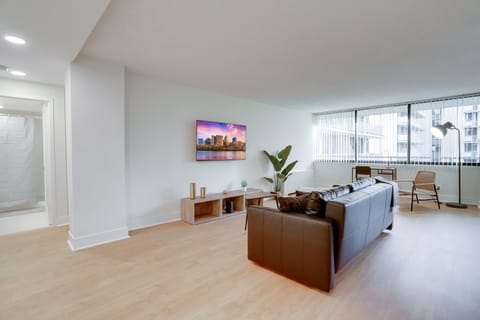 Business Apartment | Living area | 50-inch plasma TV with cable channels, books