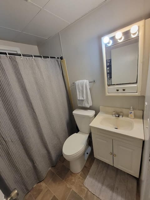 Clean and organized full bathroom with vanity Mirror 