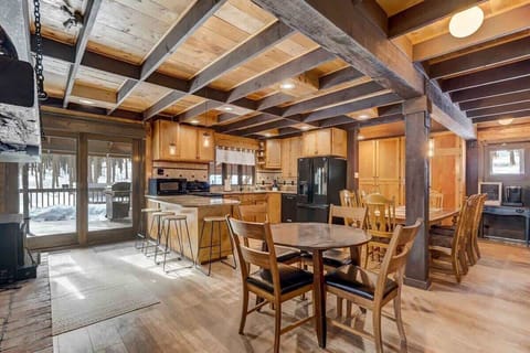 Welcome to the heart of the home, where culinary adventures await! With a kitchen stocked to the brim and a door beckoning to the BBQ and pines outside, it's like having your own gourmet getaway!