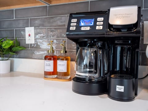 Wake up to the aroma of freshly brewed coffee from our sleek coffee maker.