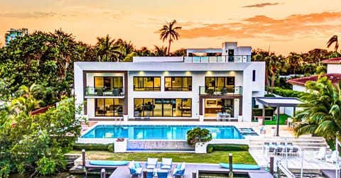 This exquisite waterfront modern villa embodies the quintessence o tranquility and serenity just a short 10 min walk to Bahia Mar beach and steps from restaurants.