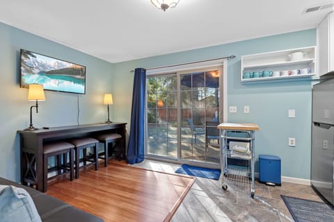 Living Room and Kitchen with Access to the Basketball Hoop and Outdoor Dining Space - Seating for Three (3) at Bar Style Table for Dining